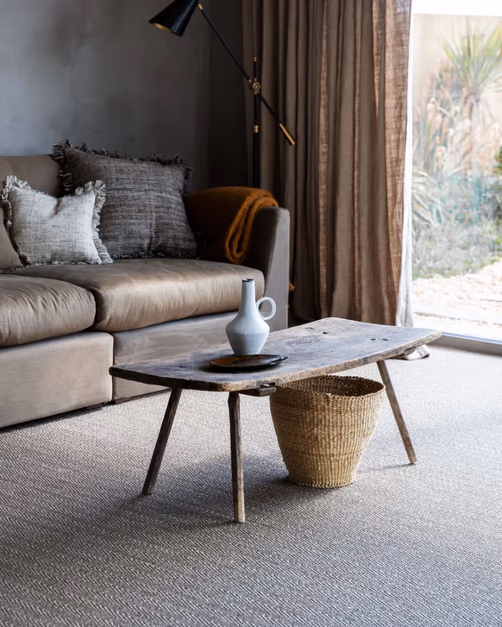 A living room with a eco-friendly natural sisal carpet.
