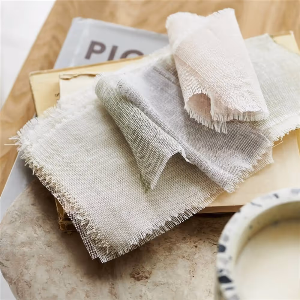 A selection of voile curtain samples in pastel shades.