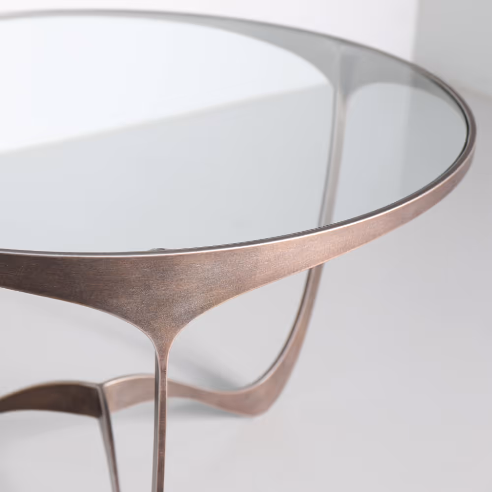 A handmade contemporary metal and glass side table.